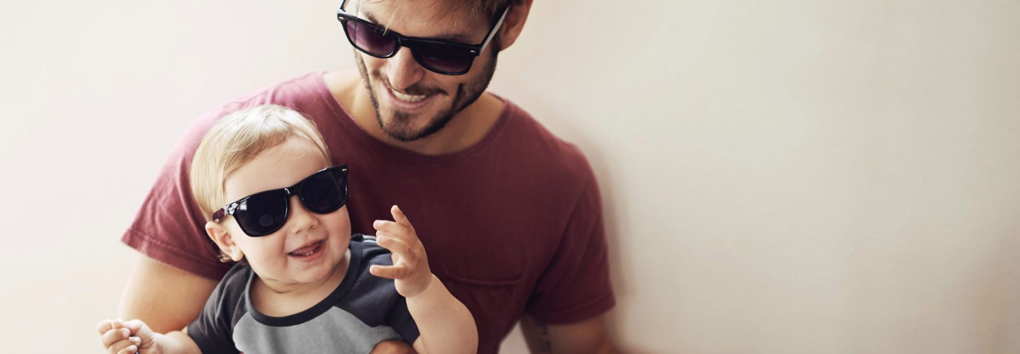 a man and a baby boy wearing sunglasses