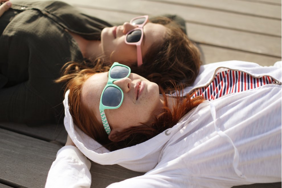Two teenagers wearing sunglasses